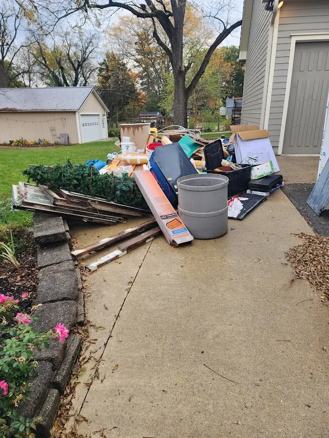 Dumpster being loaded with debris for Residential Dumpster Rental in Middlesex